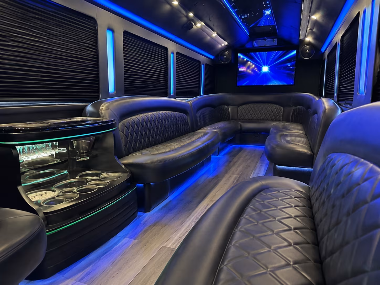 Friends laughing during a party bus celebration in Boise